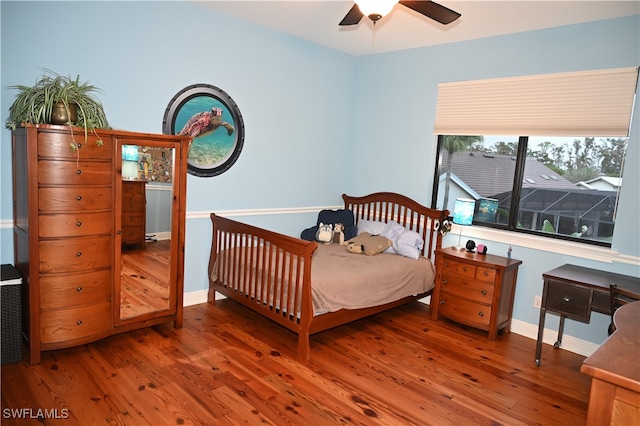 bedroom featuring hardwood / wood-style flooring and ceiling fan