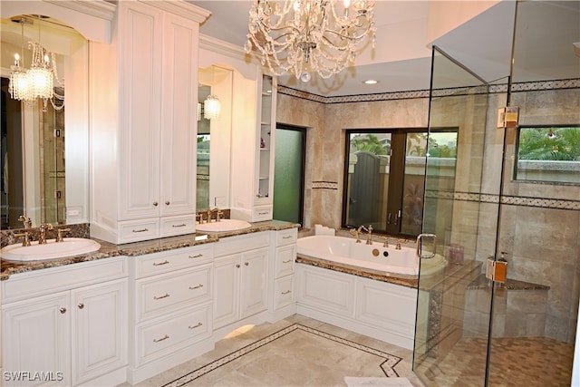 bathroom with vanity, an inviting chandelier, ornamental molding, and plus walk in shower