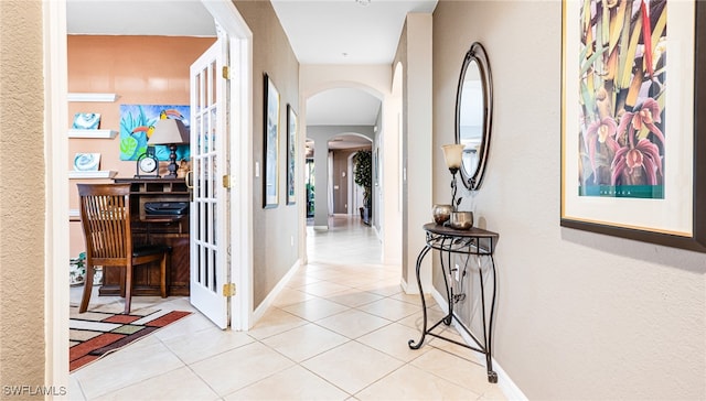 corridor featuring light tile patterned floors