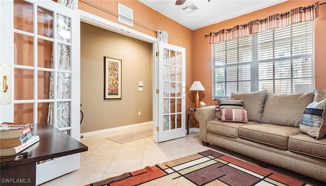 14801 Reflection Key Cir Unit 212, Fort Myers, FL 33907 - living area featuring tile patterned floors, baseboards, and ceiling fan