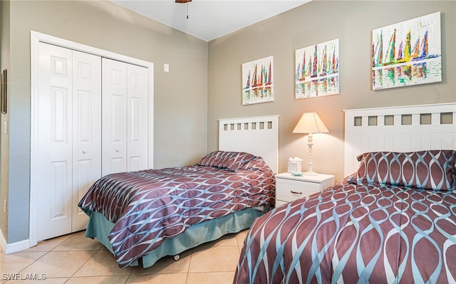 bedroom featuring a closet and light tile patterned floors