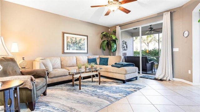 14801 Reflection Key Cir Unit 212, Fort Myers, FL 33907 - living area with a ceiling fan, light tile patterned flooring, and baseboards