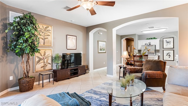 tiled living room featuring ceiling fan