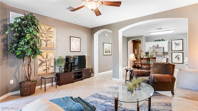 14801 Reflection Key Cir Unit 212, Fort Myers, FL 33907 - living area with ceiling fan, light tile patterned flooring, arched walkways, and baseboards