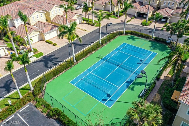 14801 Reflection Key Cir Unit 212, Fort Myers, FL 33907 - view of tennis court with a residential view and fence