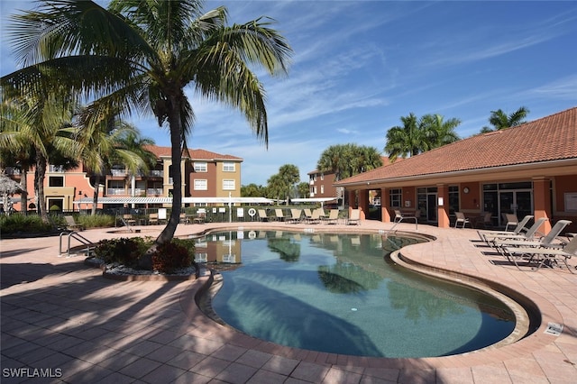 view of swimming pool featuring a patio area