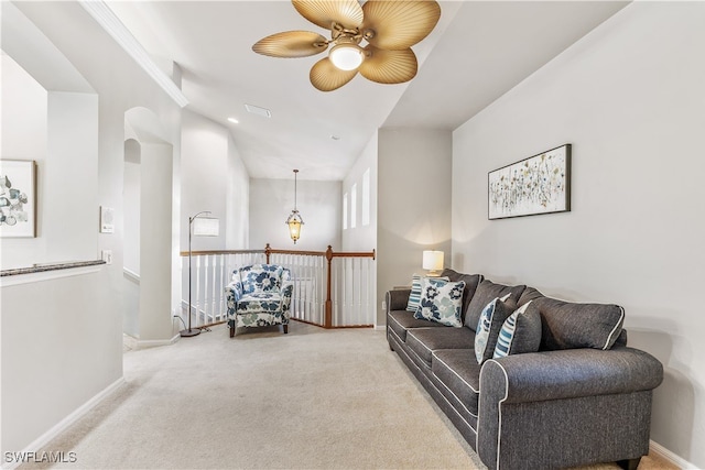 living room with carpet and ceiling fan