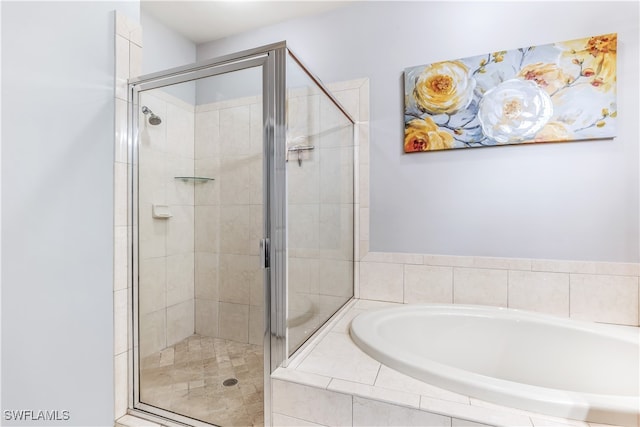 bathroom with shower with separate bathtub