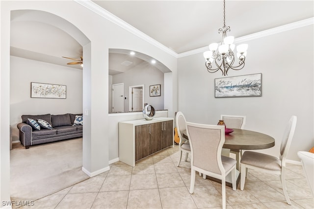 tiled dining area with crown molding and ceiling fan with notable chandelier