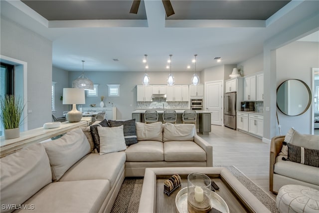 living room with light hardwood / wood-style flooring