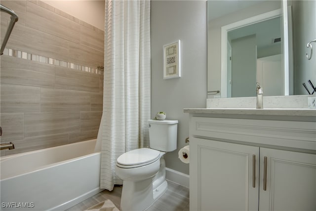 full bathroom with vanity, shower / bath combo, and toilet