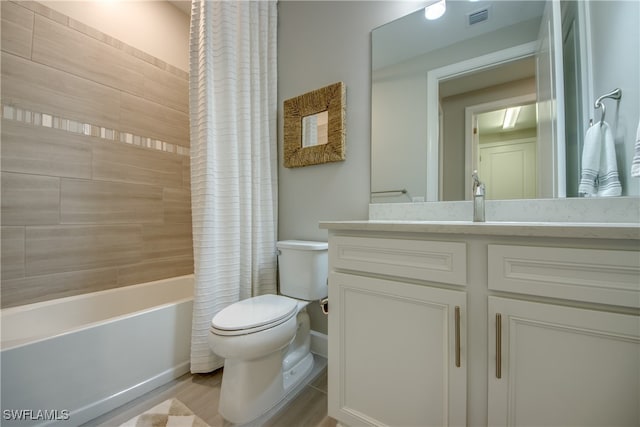 full bathroom with vanity, hardwood / wood-style floors, shower / bath combination with curtain, and toilet