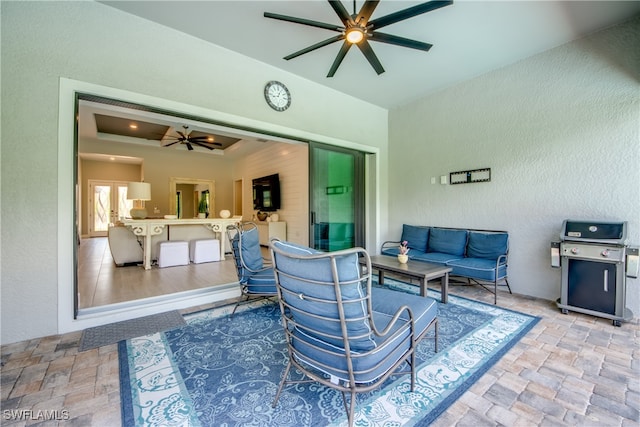 living room featuring ceiling fan