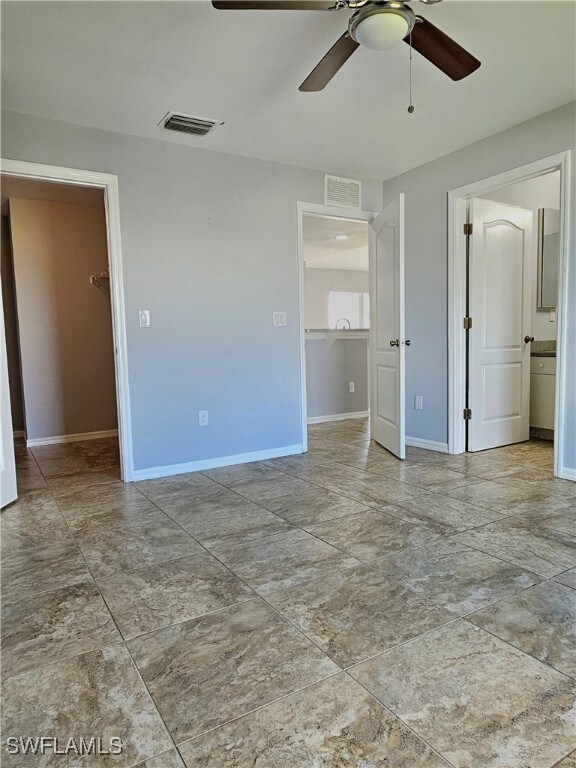 unfurnished room featuring ceiling fan