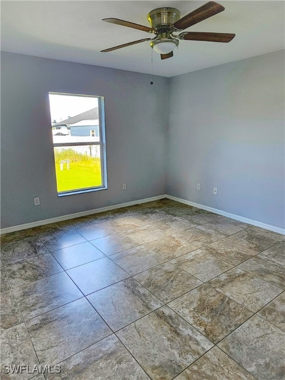 unfurnished room featuring ceiling fan