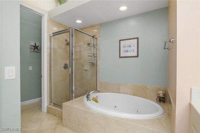 full bath with a stall shower, a tub with jets, and recessed lighting