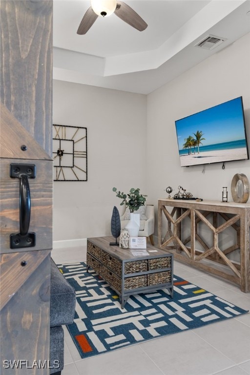 interior space with tile patterned flooring and ceiling fan