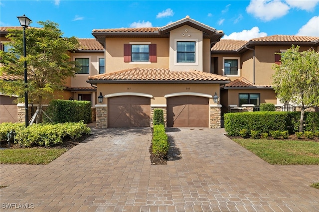 mediterranean / spanish-style home featuring a garage