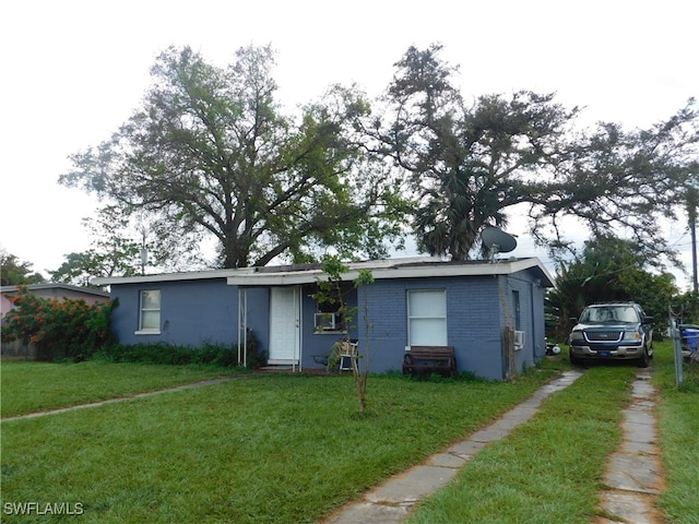 ranch-style house with a front lawn