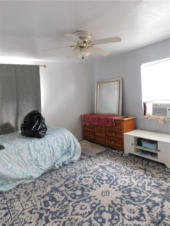 bedroom with ceiling fan and cooling unit