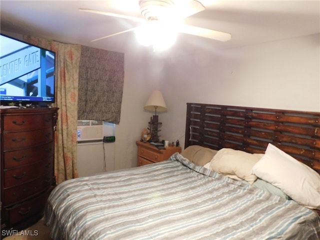 bedroom with cooling unit and ceiling fan