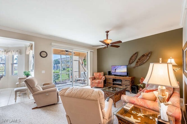 living room featuring crown molding, light tile patterned floors, and ceiling fan