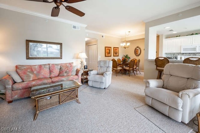 living room with ornamental molding, light colored carpet, and ceiling fan with notable chandelier