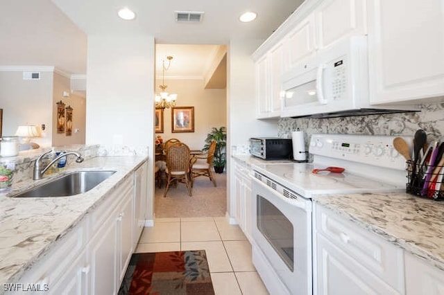 kitchen with sink, white cabinetry, crown molding, and white appliances