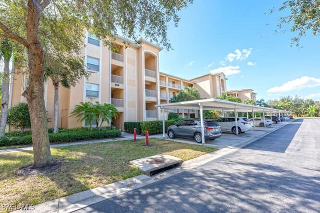 8550 Kingbird Loop Unit 618, Estero, FL 33967 - view of building exterior featuring covered parking
