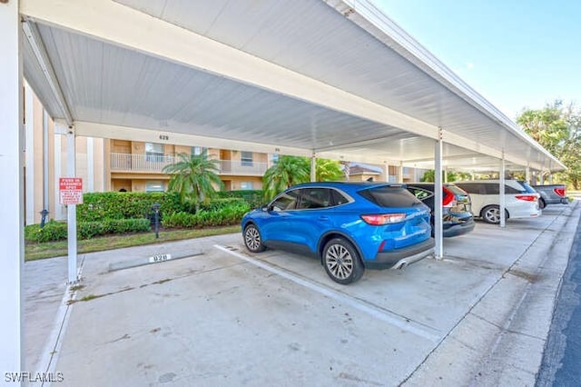 view of parking / parking lot with a carport