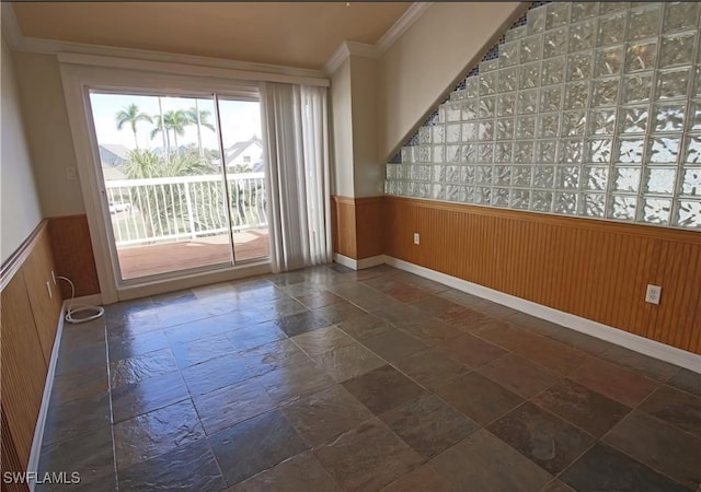 unfurnished room with crown molding