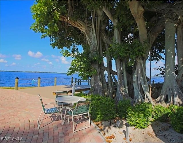 view of patio featuring a water view