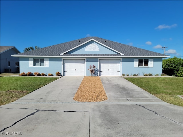 ranch-style house featuring central air condition unit, a front yard, and a garage