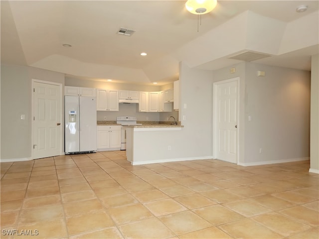 kitchen with kitchen peninsula, ceiling fan, light tile patterned floors, white cabinetry, and white appliances