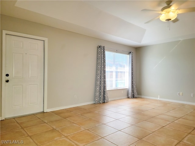 unfurnished room featuring ceiling fan and light tile patterned floors