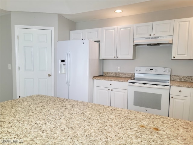 kitchen with white appliances and white cabinets