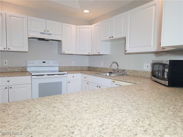 kitchen featuring white cabinetry, sink, and white appliances