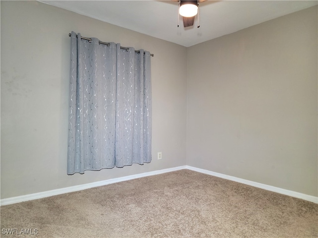 empty room featuring carpet flooring and ceiling fan