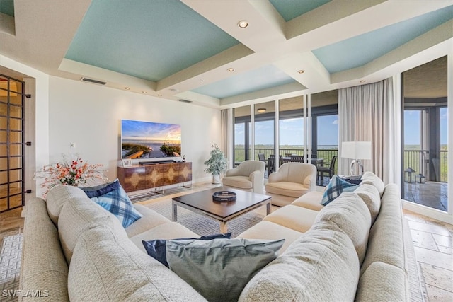 living room featuring coffered ceiling