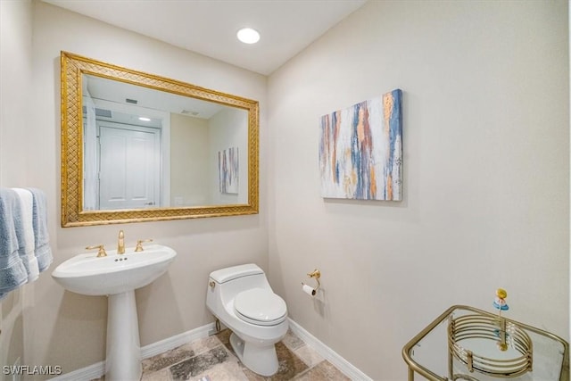 4875 Pelican Colony Blvd Unit 304, Bonita Springs, FL 34134 - half bathroom featuring baseboards and toilet