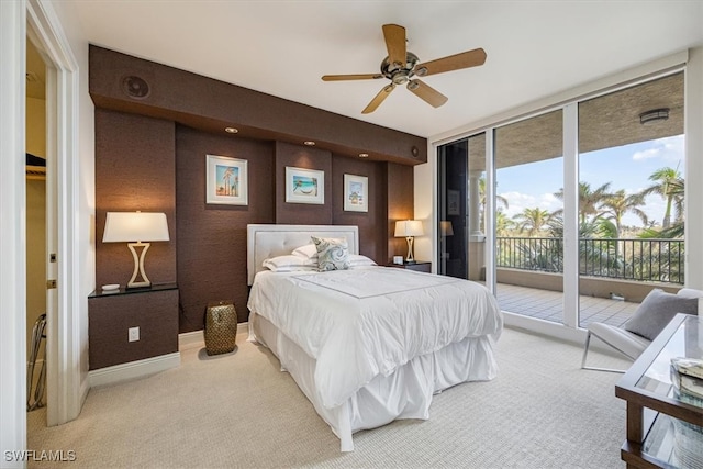 carpeted bedroom featuring access to outside and ceiling fan