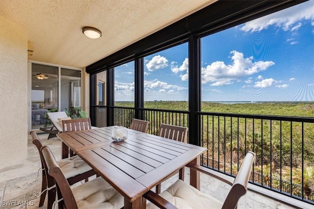 4875 Pelican Colony Blvd Unit 304, Bonita Springs, FL 34134 - sunroom featuring a textured ceiling, healthy amount of natural light, and a ceiling fan