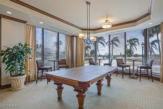 playroom featuring crown molding, a chandelier, light colored carpet, and a tray ceiling