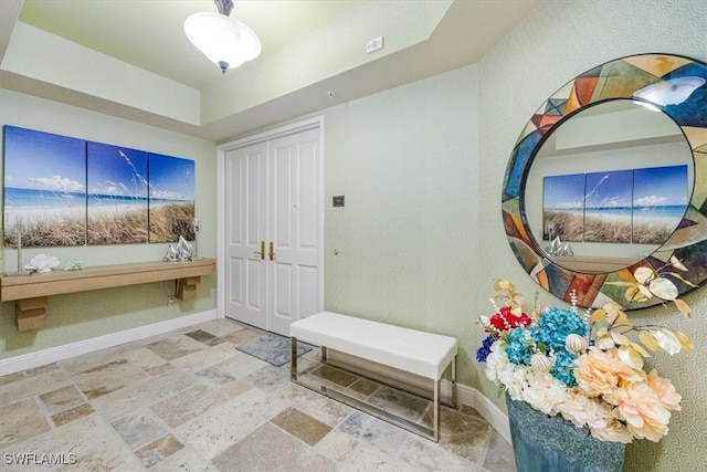 4875 Pelican Colony Blvd Unit 304, Bonita Springs, FL 34134 - foyer featuring stone finish flooring and a tray ceiling