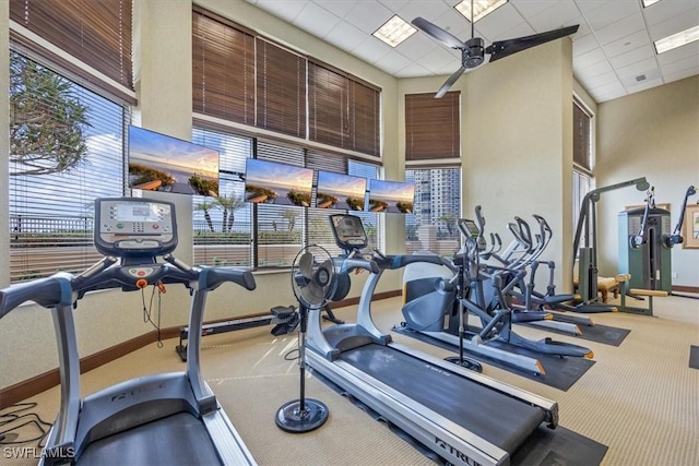 4875 Pelican Colony Blvd Unit 304, Bonita Springs, FL 34134 - exercise room with carpet floors, a ceiling fan, a drop ceiling, and a towering ceiling