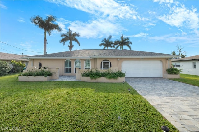 single story home featuring a front yard and a garage