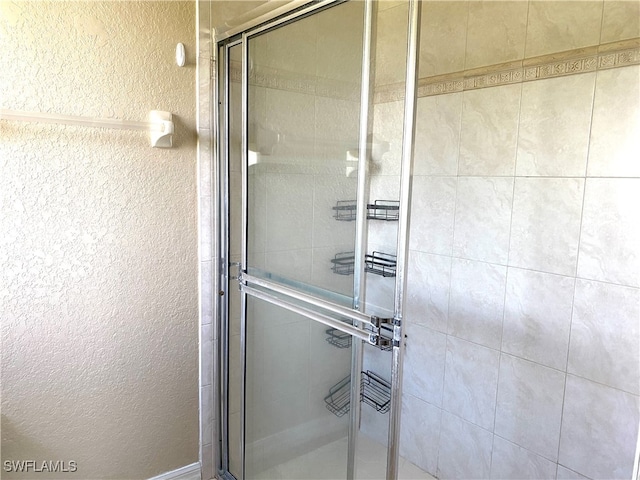 bathroom with an enclosed shower