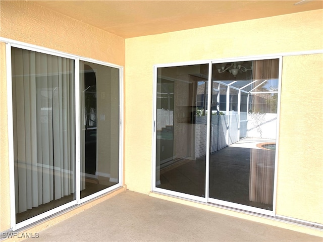 entrance to property with a patio area