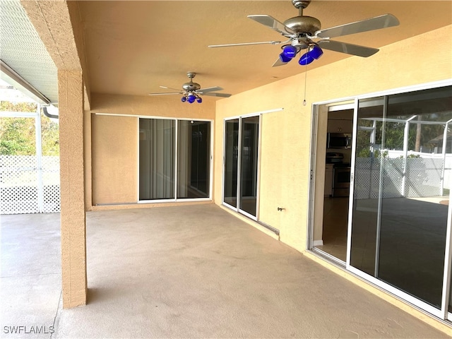 view of patio featuring ceiling fan