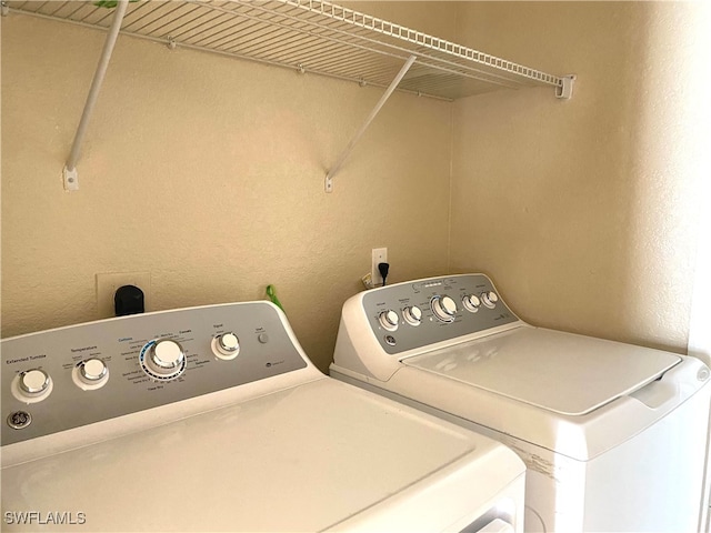 laundry room with washer and dryer